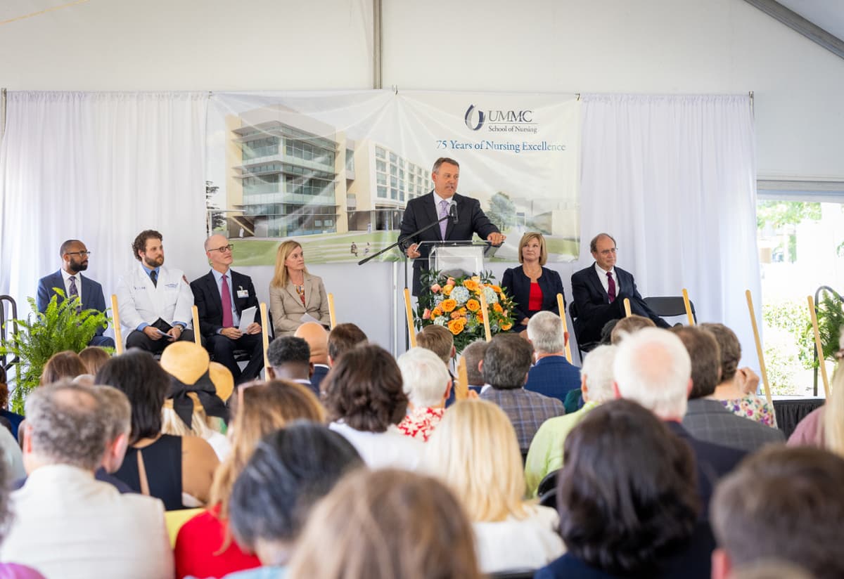 Rep. Jason White, speaker pro tempore of the state House of Representatives, speaks outside the site of the new UMMC School of Nursing before he and others shovel out sand signifying groundbreaking.